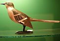 Hand-carved and painted one-of-a-kind Mockingbird by Ivy Billiot of the United Houma Nation